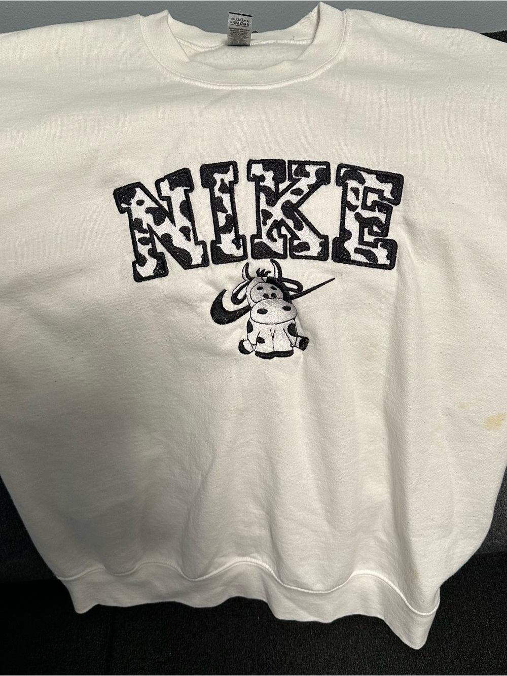Nike White Sweatshirt with Black Cow-Print Logo